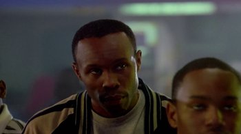 Movie still from “Paid in Full” (2002), directed by Charles Stone III – A person wearing a jacket; Close Up shot, Over the shoulder angle