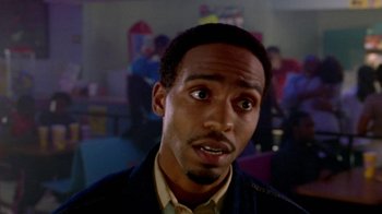 Movie still from “Paid in Full” (2002), directed by Charles Stone III – A person wearing a jacket; Close Up shot, Over the shoulder angle