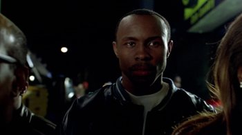 Movie still from “Paid in Full” (2002), directed by Charles Stone III – A person holding a guitar; Close Up shot, Low angle