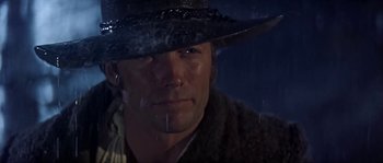 Movie still from “Paint Your Wagon” (1969), directed by Joshua Logan – A person wearing a cowboy hat; Close Up shot, Low angle