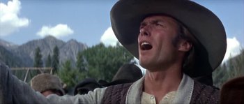 Movie still from “Paint Your Wagon” (1969), directed by Joshua Logan – A man in a cowboy hat is crying; Close Up shot, Low angle