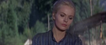 Movie still from “Paint Your Wagon” (1969), directed by Joshua Logan – A woman with blonde hair is looking down at her face; Close Up shot, Over the shoulder angle