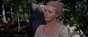 Movie still from “Paint Your Wagon” (1969), directed by Joshua Logan – A woman with blonde hair wearing a white dress; Close Up shot, Over the shoulder angle