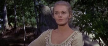 Movie still from “Paint Your Wagon” (1969), directed by Joshua Logan – A beautiful woman with blonde hair wearing a white dress; Close Up shot, Low angle