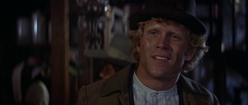 Movie still from “Paint Your Wagon” (1969), directed by Joshua Logan – A person wearing a cowboy hat; Close Up shot, Low angle