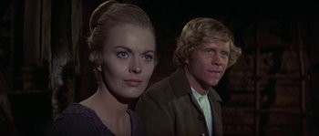 Movie still from “Paint Your Wagon” (1969), directed by Joshua Logan – A man and a woman standing next to each other; Close Up shot, Low angle