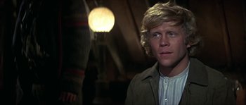 Movie still from “Paint Your Wagon” (1969), directed by Joshua Logan – A man with blonde hair standing in front of a light; Close Up shot, Low angle