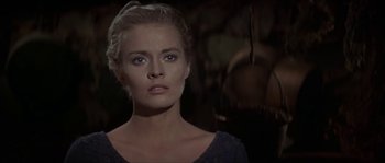 Movie still from “Paint Your Wagon” (1969), directed by Joshua Logan – A person wearing a black shirt; Close Up shot, Over the shoulder angle