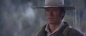 Movie still from “Paint Your Wagon” (1969), directed by Joshua Logan – A person wearing a cowboy hat; Close Up shot, Low angle