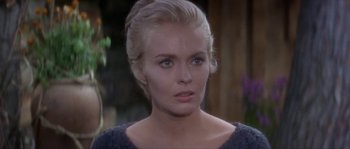 Movie still from “Paint Your Wagon” (1969), directed by Joshua Logan – A person wearing a dress; Close Up shot, Over the shoulder angle