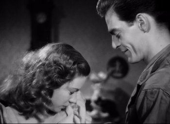 Movie still from “Paisan” (1946), directed by Roberto Rossellini – A man and a woman looking at one another; Close Up shot, Low angle