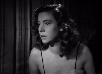 Movie still from “Paisan” (1946), directed by Roberto Rossellini – A black - and - white photo of a woman with long hair; Close Up shot, Low angle