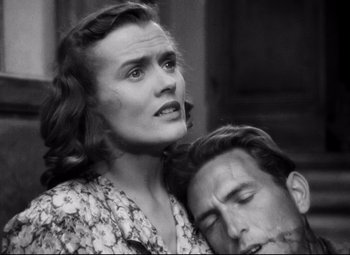 Movie still from “Paisan” (1946), directed by Roberto Rossellini – An old black and white photo of a man and a woman; Close Up shot, High angle