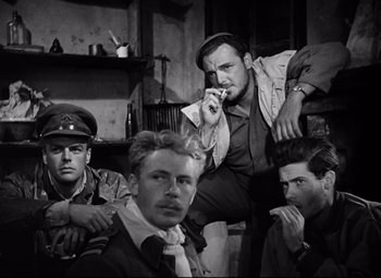 Movie still from “Paisan” (1946), directed by Roberto Rossellini – A black and white photo of a group of men; Medium shot, Low angle