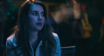 Movie still from “Palo Alto” (2013), directed by Gia Coppola – A woman sitting in front of a window at night; Close Up shot, Over the shoulder angle