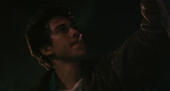 Movie still from “Palo Alto” (2013), directed by Gia Coppola – A young man smoking a cigarette in the dark; Close Up shot, Low angle