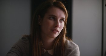 Movie still from “Palo Alto” (2013), directed by Gia Coppola – A woman with long red hair looking to her left; Close Up shot, Over the shoulder angle
