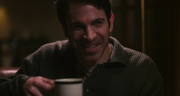 Movie still from “Palo Alto” (2013), directed by Gia Coppola – A man smiling while holding a cup of coffee; Close Up shot, Over the shoulder angle