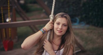 Movie still from “Palo Alto” (2013), directed by Gia Coppola – A woman with long hair hanging from a rope; Close Up shot, Overhead angle