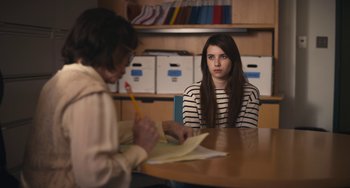 Movie still from “Palo Alto” (2013), directed by Gia Coppola – A woman sitting at a table in front of another woman; Medium shot, Over the shoulder angle