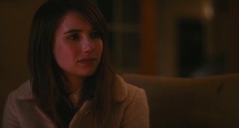 Movie still from “Palo Alto” (2013), directed by Gia Coppola – A beautiful young lady sitting on top of a couch; Close Up shot, Over the shoulder angle