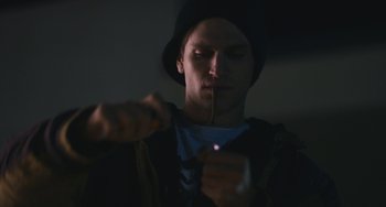 Movie still from “Palo Alto” (2013), directed by Gia Coppola – A young man lighting a cigarette in the dark; Close Up shot, Low angle