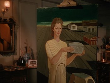Movie still from “Pandora and the Flying Dutchman” (1951), directed by Albert Lewin – A painting of a woman holding an object in her hands; Medium shot, Low angle