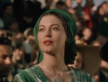 Movie still from “Pandora and the Flying Dutchman” (1951), directed by Albert Lewin – A person wearing a head scarf; Close Up shot, Low angle
