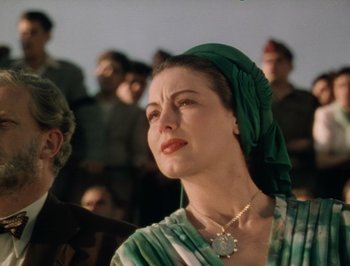 Movie still from “Pandora and the Flying Dutchman” (1951), directed by Albert Lewin – A person wearing a head scarf; Close Up shot, Low angle