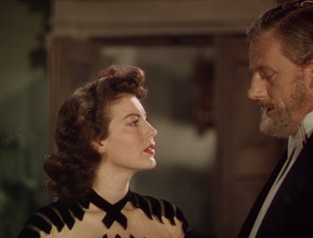 Movie still from “Pandora and the Flying Dutchman” (1951), directed by Albert Lewin – An older man and a young woman are looking at each other; Close Up shot, Over the shoulder angle