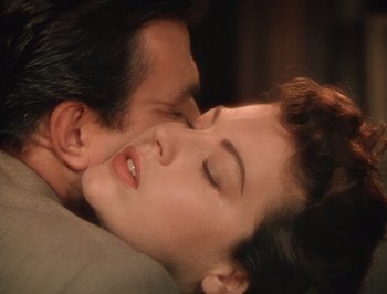Movie still from “Pandora and the Flying Dutchman” (1951), directed by Albert Lewin – A man and a woman laying on top of each other; Close Up shot, Overhead angle