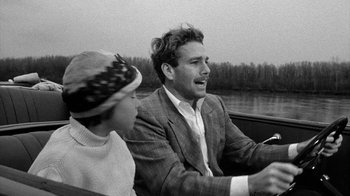 Movie still from “Paper Moon” (1973), directed by Peter Bogdanovich – A black and white photo of a man and a woman in a boat; Close Up shot, Over the shoulder angle