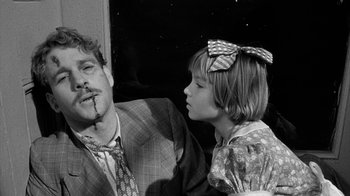 Movie still from “Paper Moon” (1973), directed by Peter Bogdanovich – A man and a little girl are looking at each other; Close Up shot, Over the shoulder angle