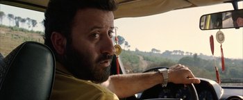 Movie still from “Paradise Now” (2005), directed by Hany Abu-Assad – A person driving a car; Close Up shot, Low angle