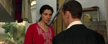Movie still from “Paradise Now” (2005), directed by Hany Abu-Assad – A man and a woman are standing next to each other; Close Up shot, Over the shoulder angle