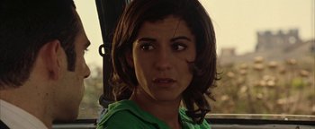 Movie still from “Paradise Now” (2005), directed by Hany Abu-Assad – A person wearing a green shirt; Close Up shot, Over the shoulder angle