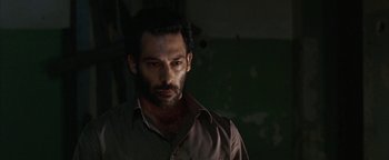 Movie still from “Paradise Now” (2005), directed by Hany Abu-Assad – A person wearing a shirt; Close Up shot, Low angle