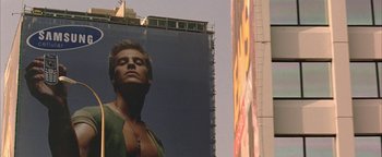 Movie still from “Paradise Now” (2005), directed by Hany Abu-Assad – A man standing in front of a tall building; Close Up shot, Low angle