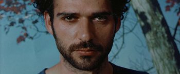 Movie still from “Paradise Now” (2005), directed by Hany Abu-Assad – A person with a beard; Extreme Close Up shot, Low angle