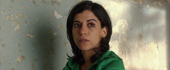 Movie still from “Paradise Now” (2005), directed by Hany Abu-Assad – A person wearing a green shirt; Close Up shot, High angle