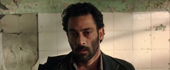 Movie still from “Paradise Now” (2005), directed by Hany Abu-Assad – A person wearing a jacket; Close Up shot, Low angle