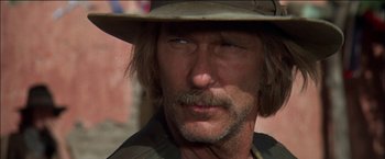 Movie still from “Pat Garrett & Billy the Kid” (1973), directed by Sam Peckinpah – A person wearing a hat; Close Up shot, Low angle