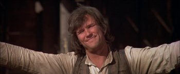 Movie still from “Pat Garrett & Billy the Kid” (1973), directed by Sam Peckinpah – A person with long black hair; Close Up shot, Low angle