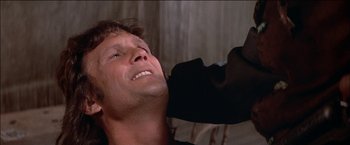 Movie still from “Pat Garrett & Billy the Kid” (1973), directed by Sam Peckinpah – A person with his eyes closed; Close Up shot, Low angle