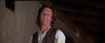 Movie still from “Pat Garrett & Billy the Kid” (1973), directed by Sam Peckinpah – A person with long hair wearing a vest; Close Up shot, Low angle