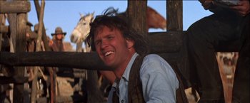 Movie still from “Pat Garrett & Billy the Kid” (1973), directed by Sam Peckinpah – A person with a horse in the background; Close Up shot, Low angle