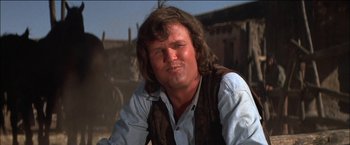 Movie still from “Pat Garrett & Billy the Kid” (1973), directed by Sam Peckinpah – A person with long hair; Close Up shot, Low angle