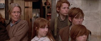 Movie still from “Pat Garrett & Billy the Kid” (1973), directed by Sam Peckinpah – A group of young people standing next to each other; Close Up shot, Low angle