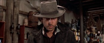 Movie still from “Pat Garrett & Billy the Kid” (1973), directed by Sam Peckinpah – A person wearing a hat; Close Up shot, Low angle