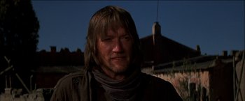 Movie still from “Pat Garrett & Billy the Kid” (1973), directed by Sam Peckinpah – A person with long hair; Close Up shot, Low angle